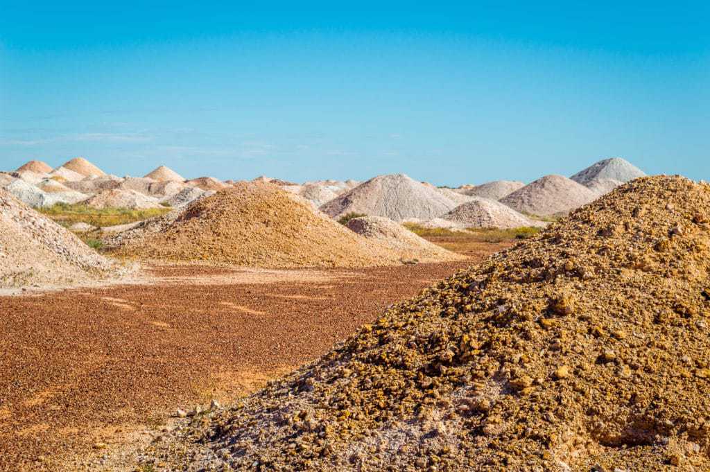 Empty desert under a blue sky.