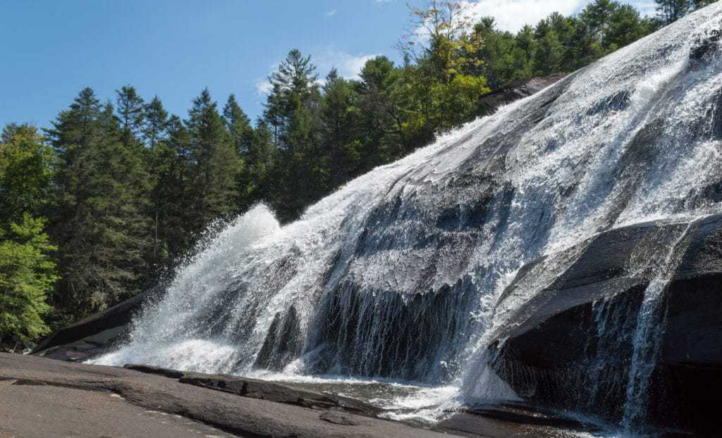 A waterfall cascades over rocks.