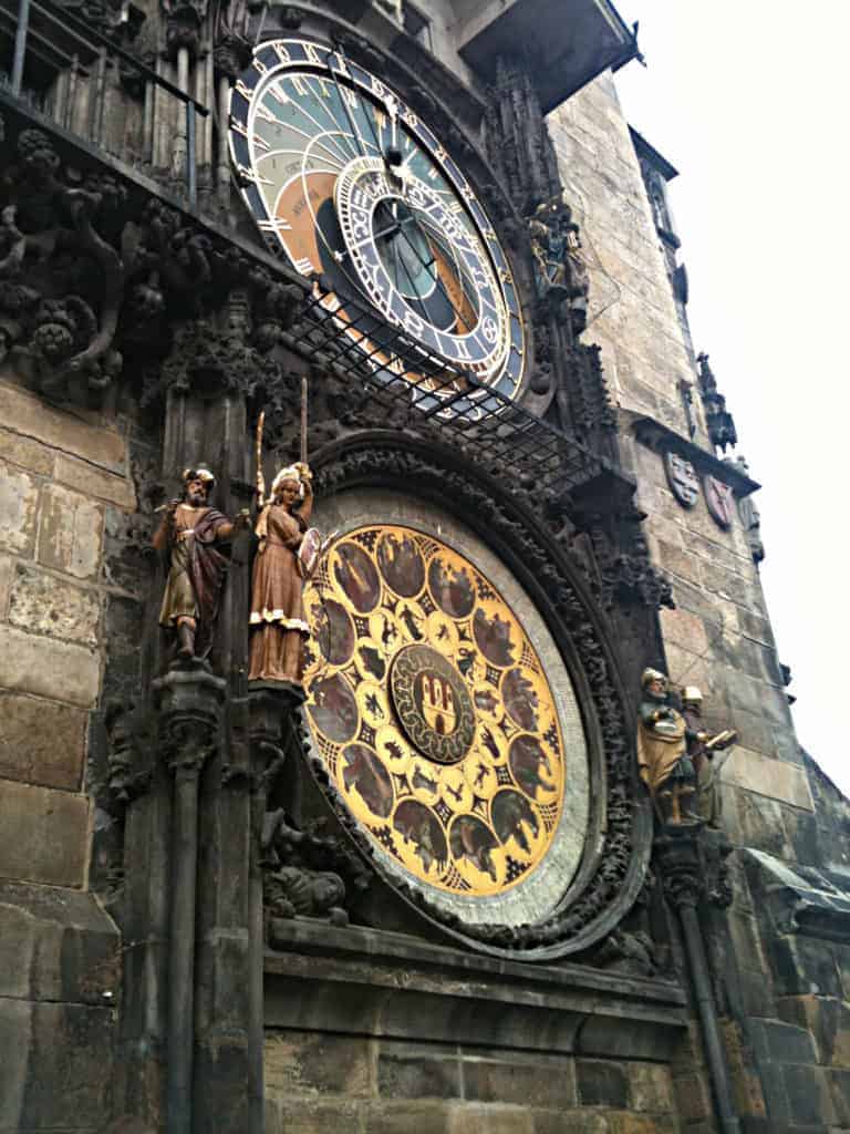 A large clock mounted to the side of a building.