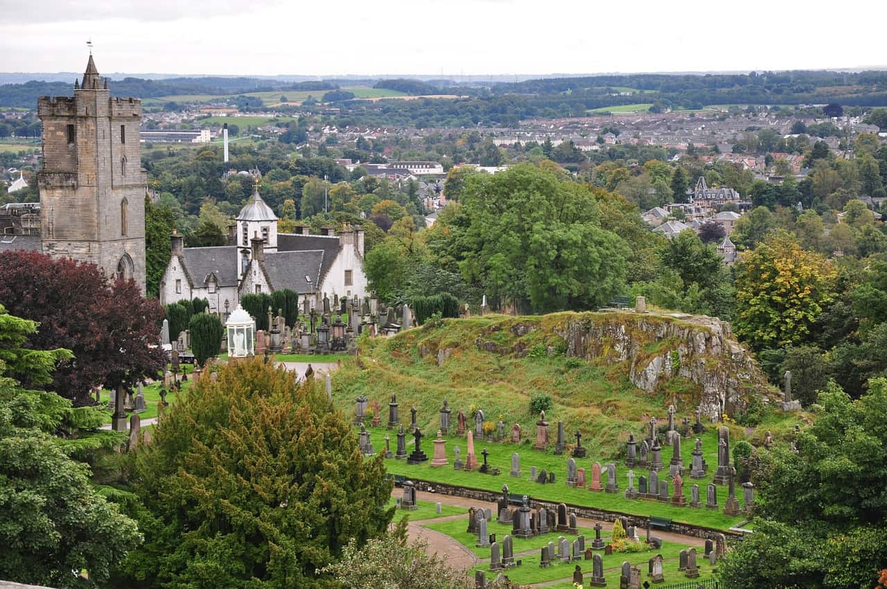 Aerial view of a graveyard under a grey sky.