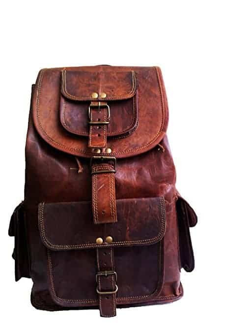 A brown leather bag with buckles.