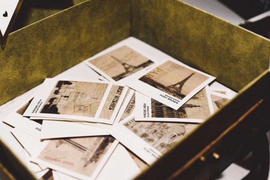 Close up of cards in a box showcasing different travel destinations.