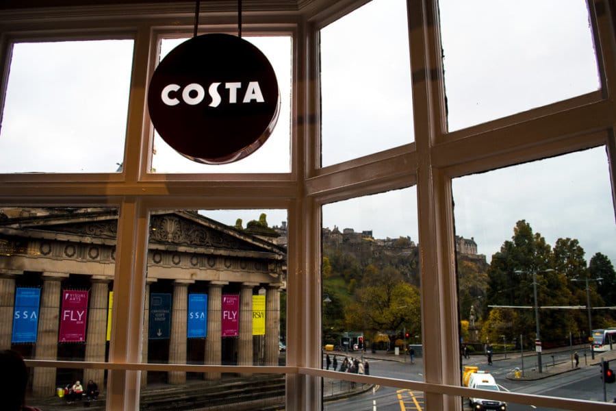 A red sign says Costa in a window.