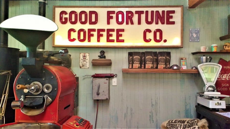 Big sign with red writing that says Good Fortune Coffee Co.