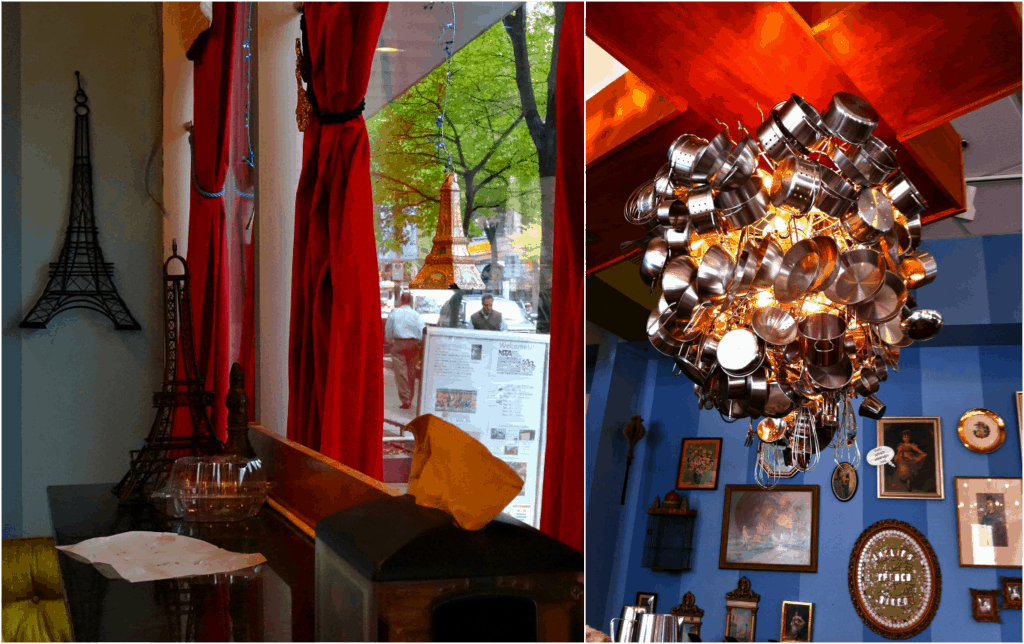 Paris memorabilia hangs from the wall, mostly of the Eiffel Tower. A big chandelier is made out of pots and pans.