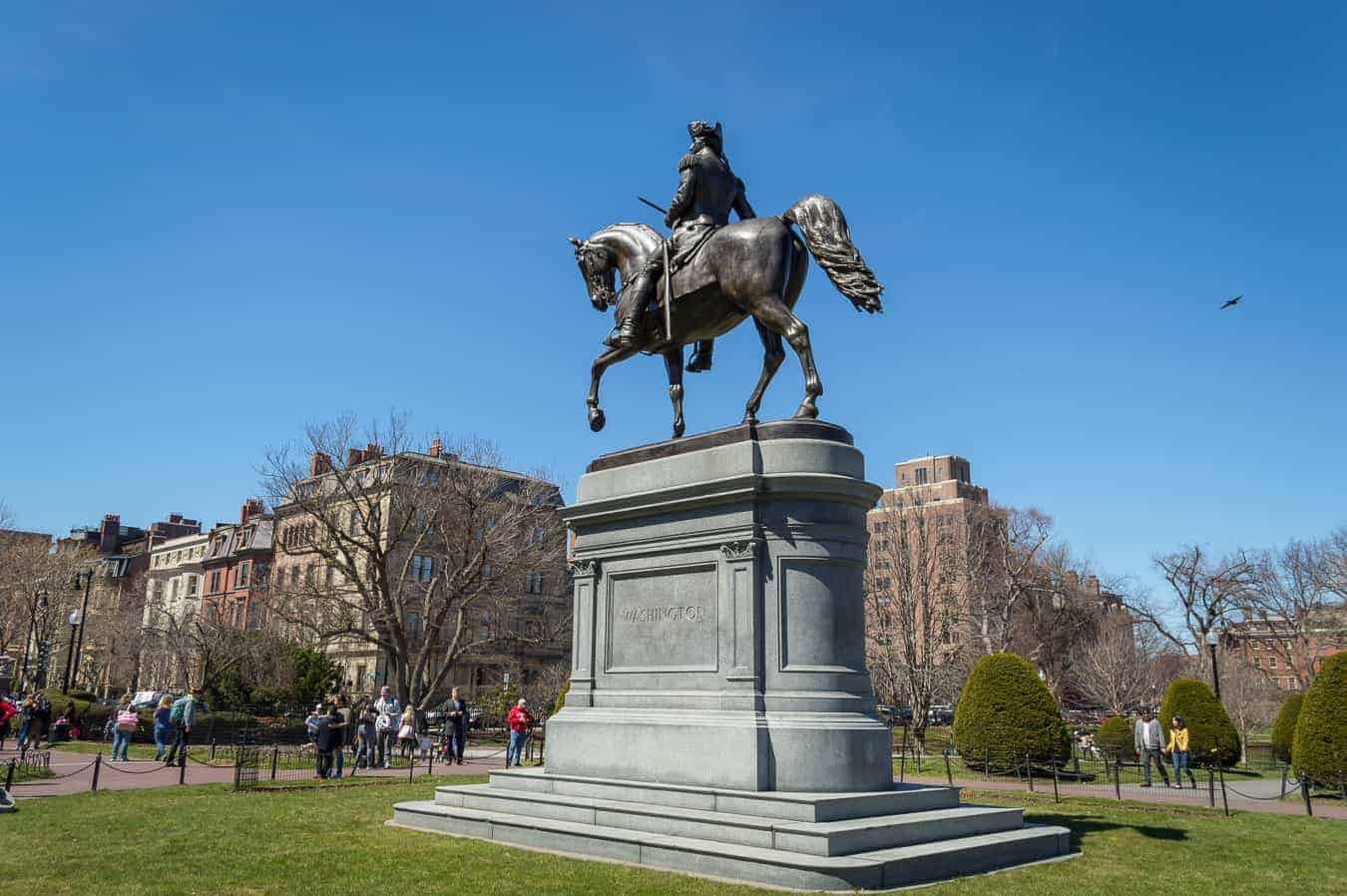 Close up of a statue of a man riding a horse.