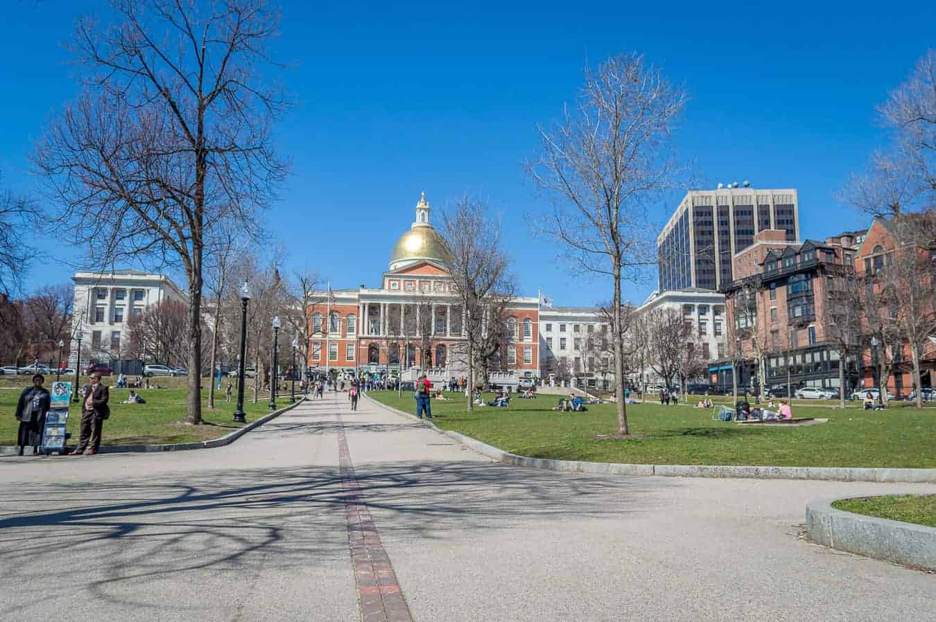 A road with a Boston capitol building in the background