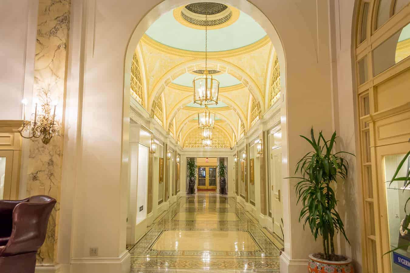 A large hallway with decorative arches and lights