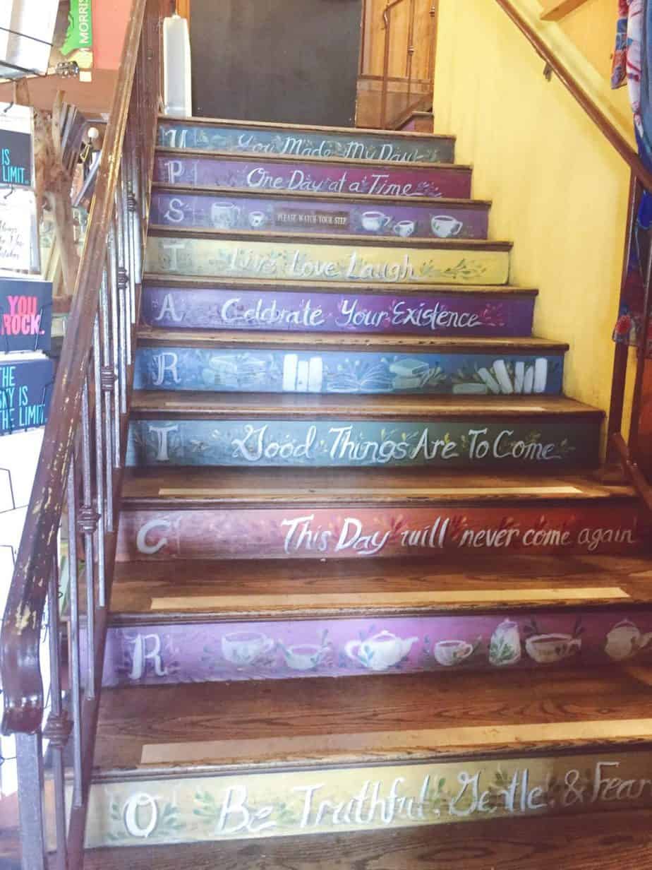 Steps are painted in a yellow room.