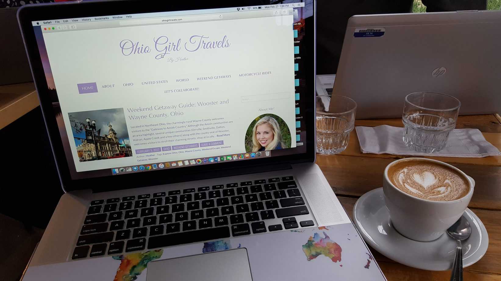 A laptop is open to a website that is called Ohio Girl Travels.