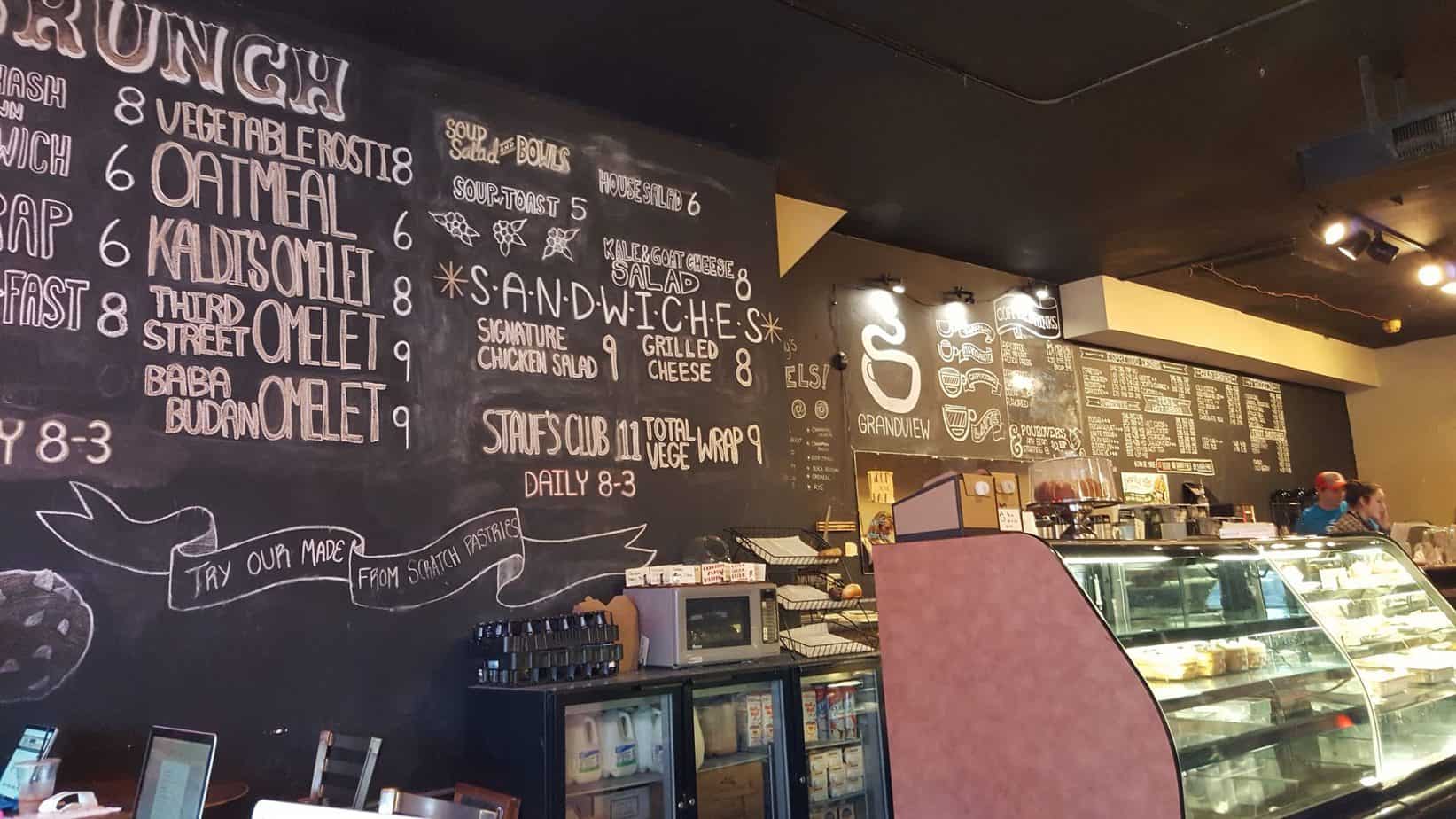 A chalkboard wall with a menu on it.
