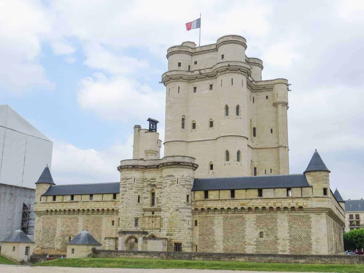 Big brick castle with a France flag.
