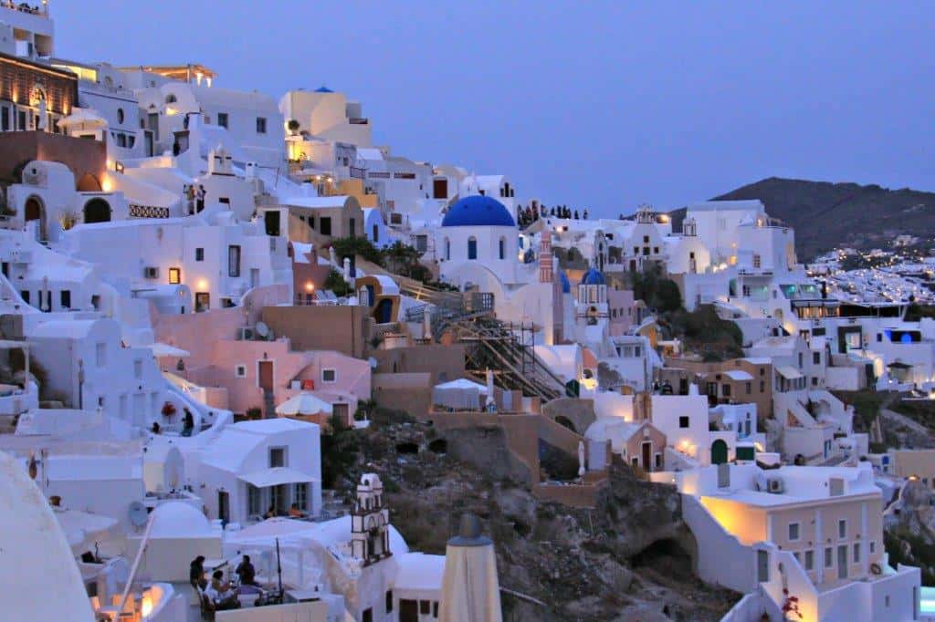 A beautiful white Greek city at night.