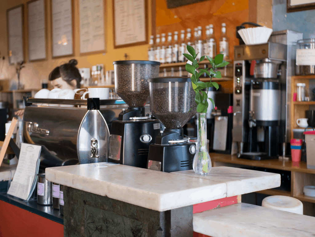 Close up of coffee grinders at a cafe.