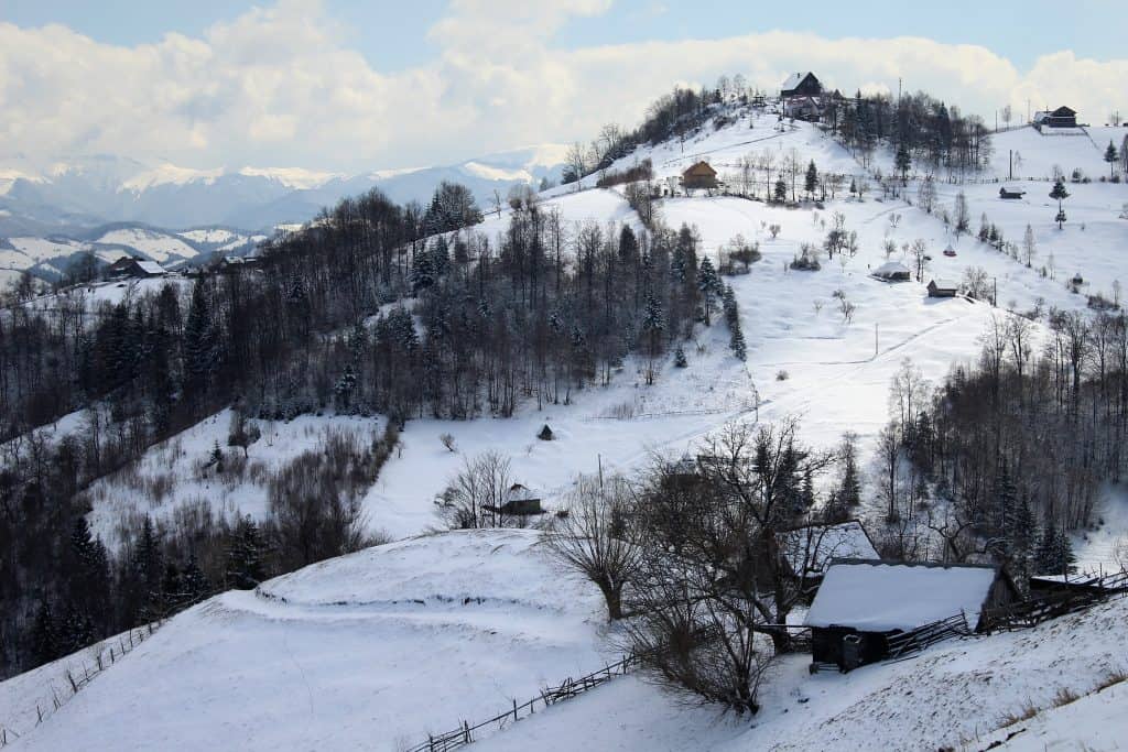 A snowy mountain under a blue sky.