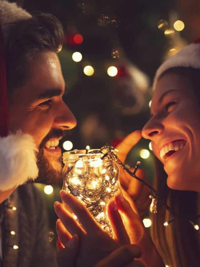 cropped-Christmas-santa-hats-couple-tree-lights-wine-date-romance-holidays-winter-bigstock-Young-Couple-In-Love-Sitting-B-259825981.jpg
