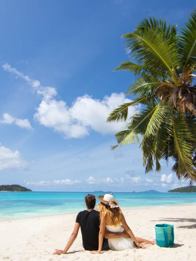 cropped-couple-on-beach-honeymoon-tropical-island-romance-travel-palm-tree-shutterstock_728310604-scaled-1.jpg
