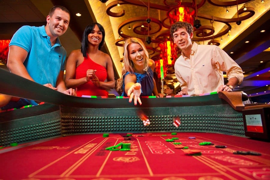 People role the dice while gambling.