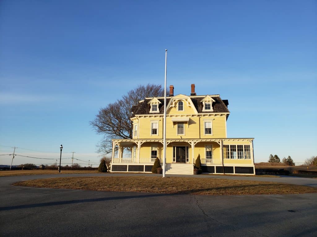 A yellow estate under a blue sky.