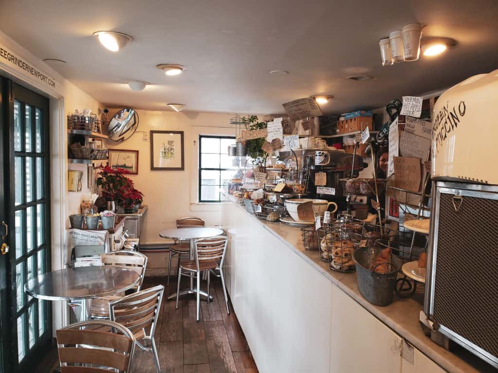 Inside of a small cafe with lots of eclectic decor.