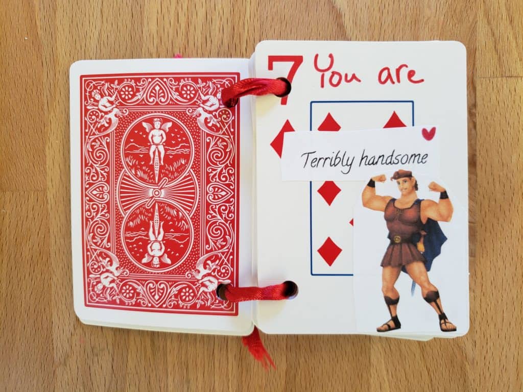 7 of Diamonds playing card that's opened and says You are terribly handsome.