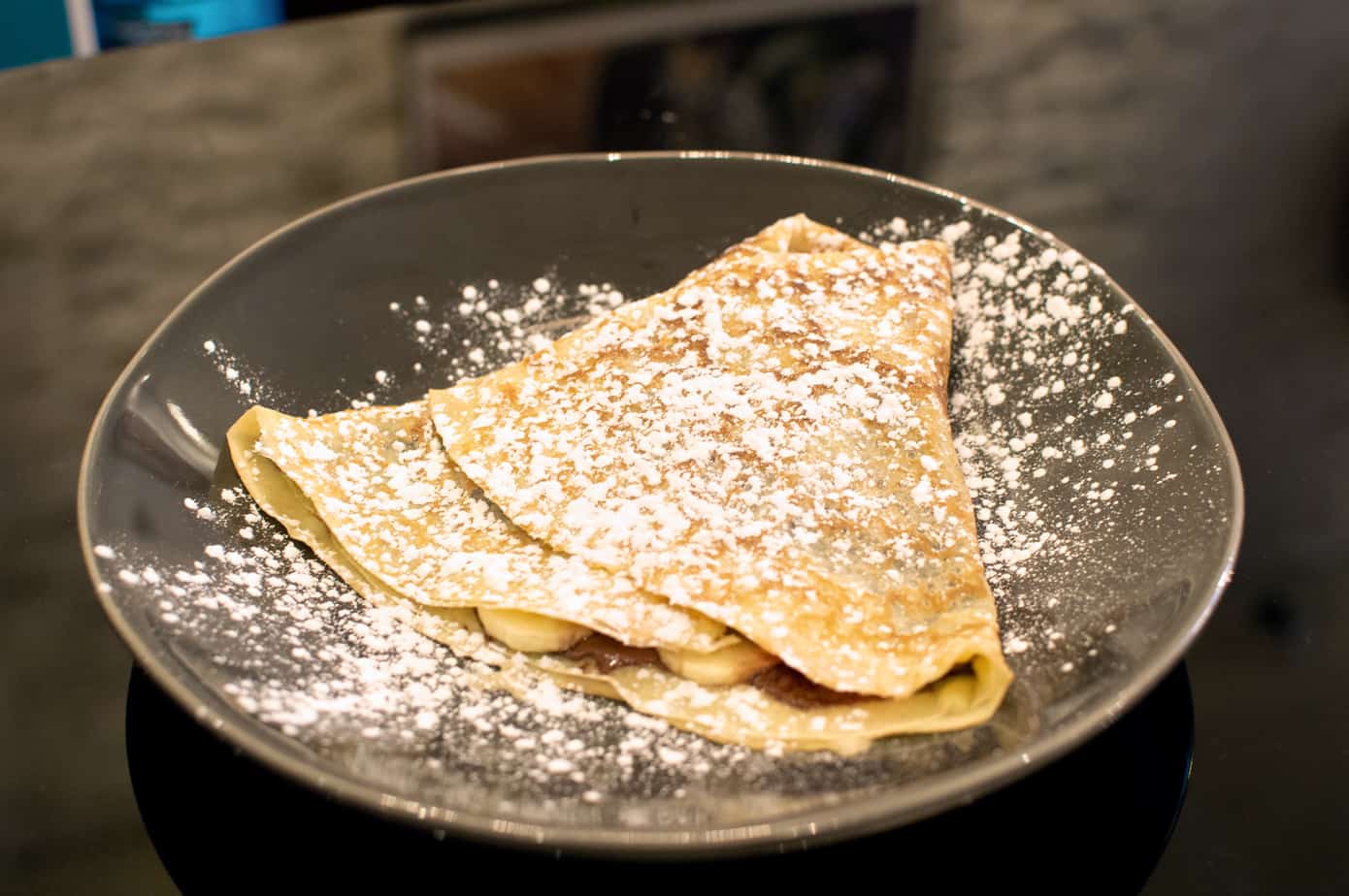Two crepes on a plate sprinkled with powdered sugar in Portsmouth New Hampshire