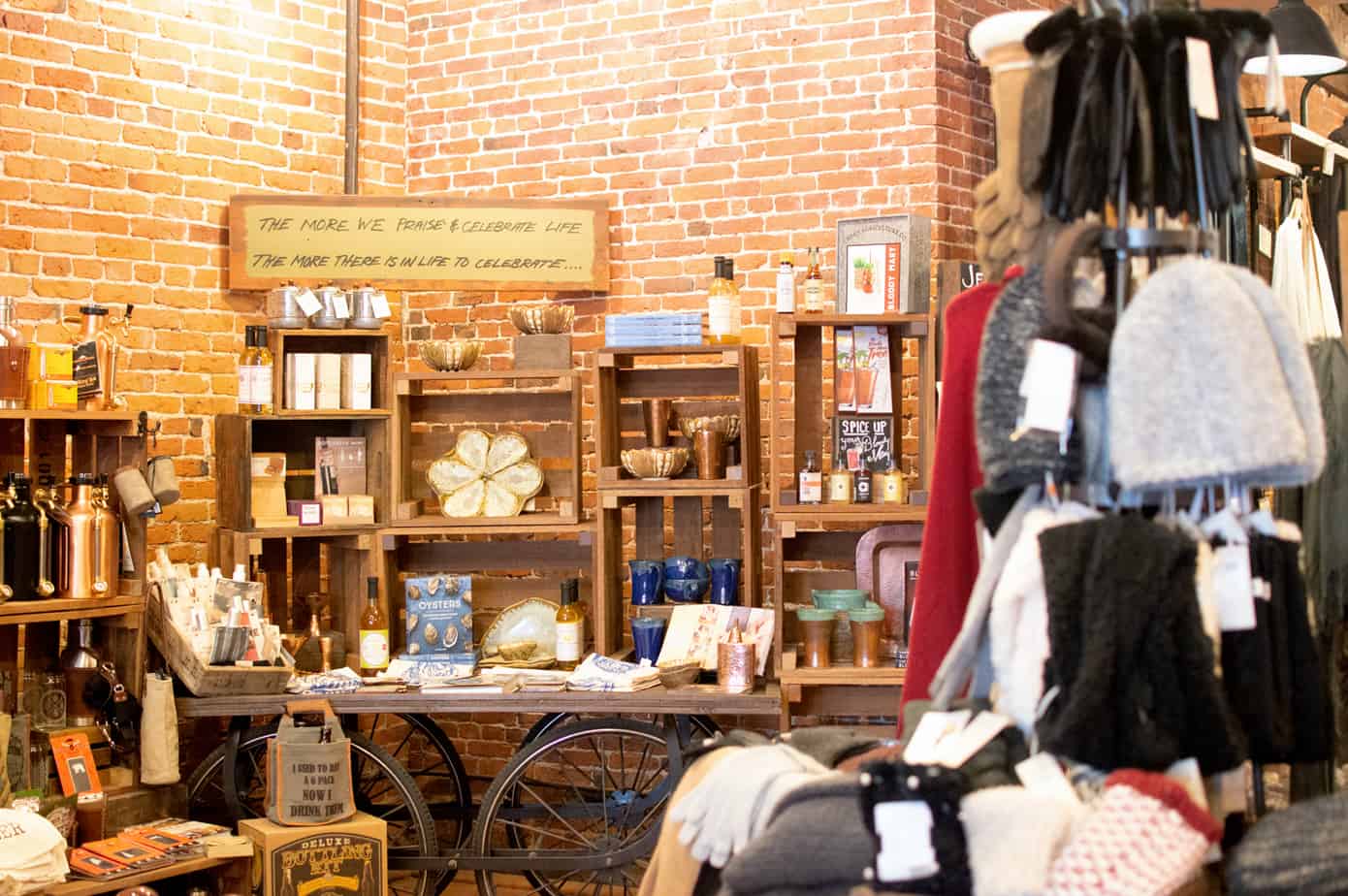 A table and chairs in front of shelves filled with books and decor in New Hampshire