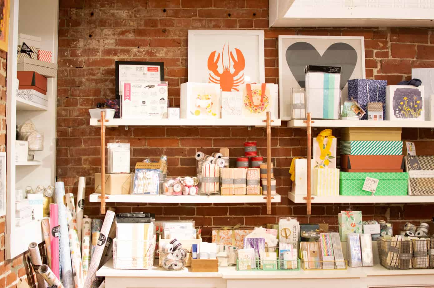 Shelves in a store that are filled with pictures and other products in Portsmouth New Hampshire