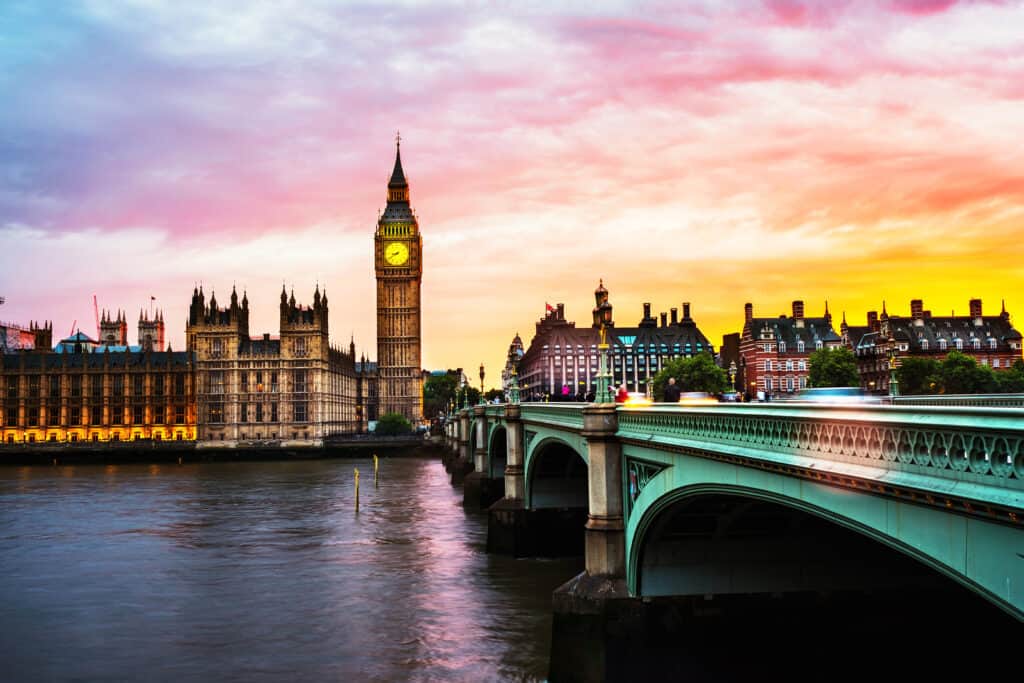 A picturesque view of a bridge and city at sunset in one of the most romantic locations in the world