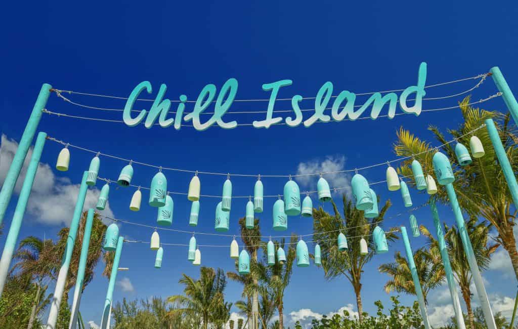 Blue lights hang from a string that says \"Chill Island.\"