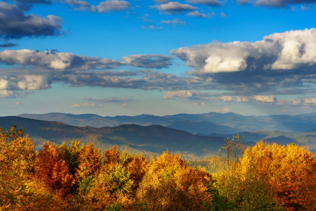 View of mountains as far as the eye can see in the fall.