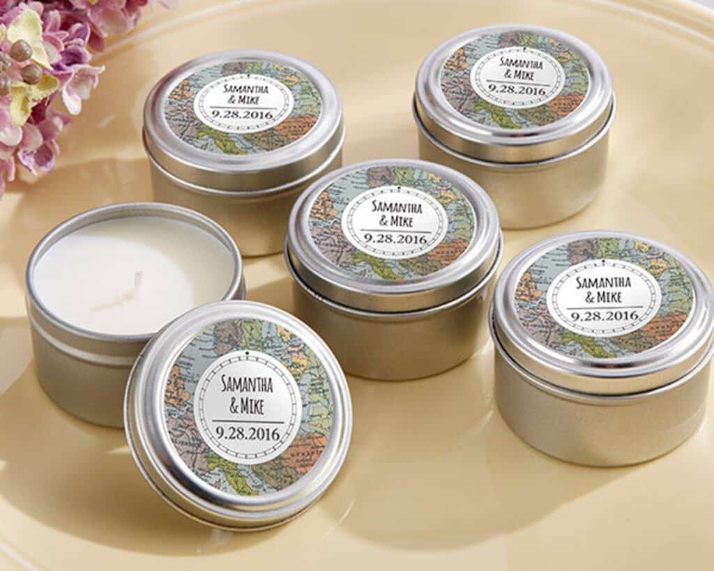 Small tin candles feature a top with a map along with a couple\'s name and wedding date.
