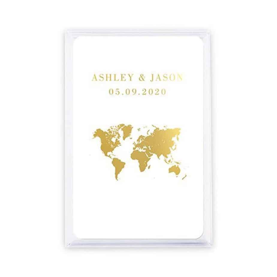 A gold map has a couple\'s name and wedding date above.