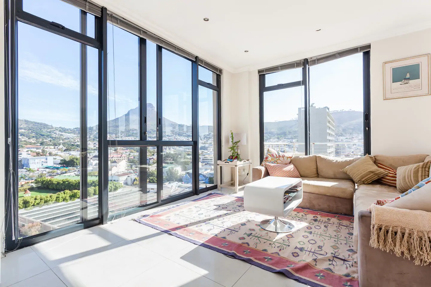 Clean living room with tall windows.