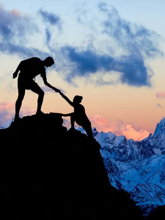 cropped-couple-silhouettes-on-mountain-hiking-holding-hands-sunset-snow-winter-outdoors-bigstock-Teamwork-Couple-Helping-Hand-294325993.jpg