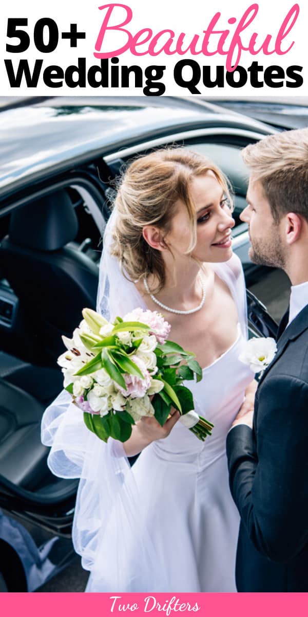A couple leans in to kiss one another next to a car on their wedding day.