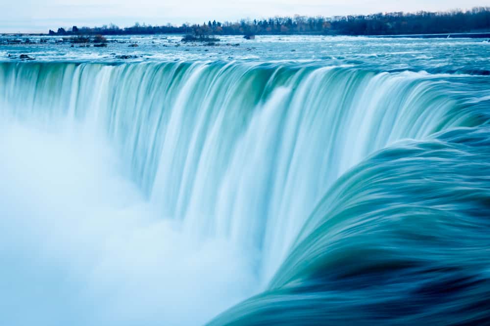 Large waterfall crashes.