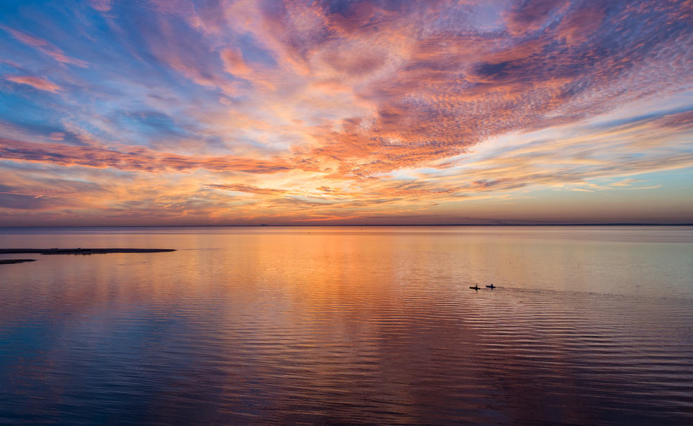 A coastal sunset during a romantic vacation on Valentine's Day