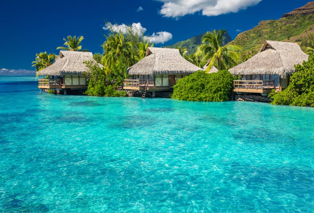 Overwater villas in a tropical lagoon.