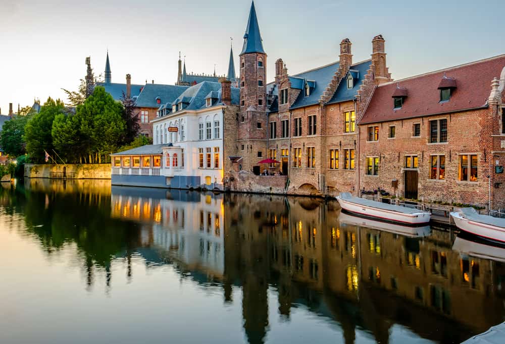 Bruges (Brugge) cityscape with water canal at sunset, Flanders, Belgium