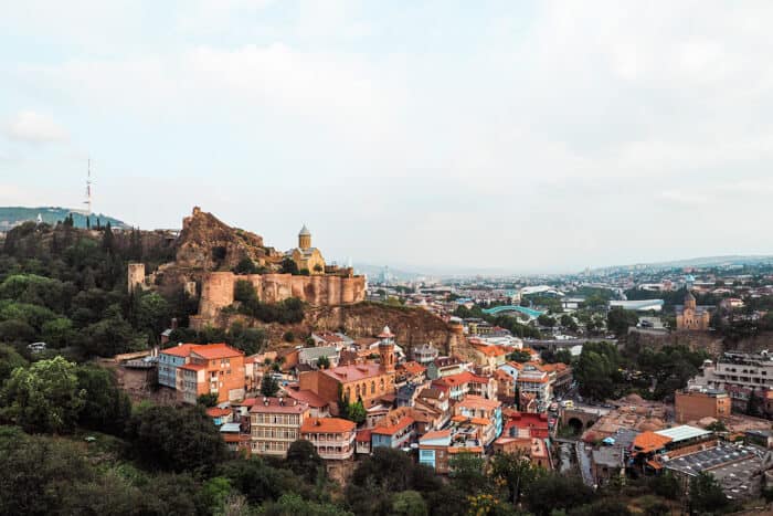 View of a city with mountains surrounding.