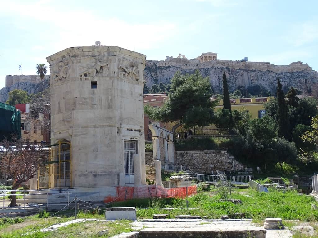 Historic tower with landmarks in the background.