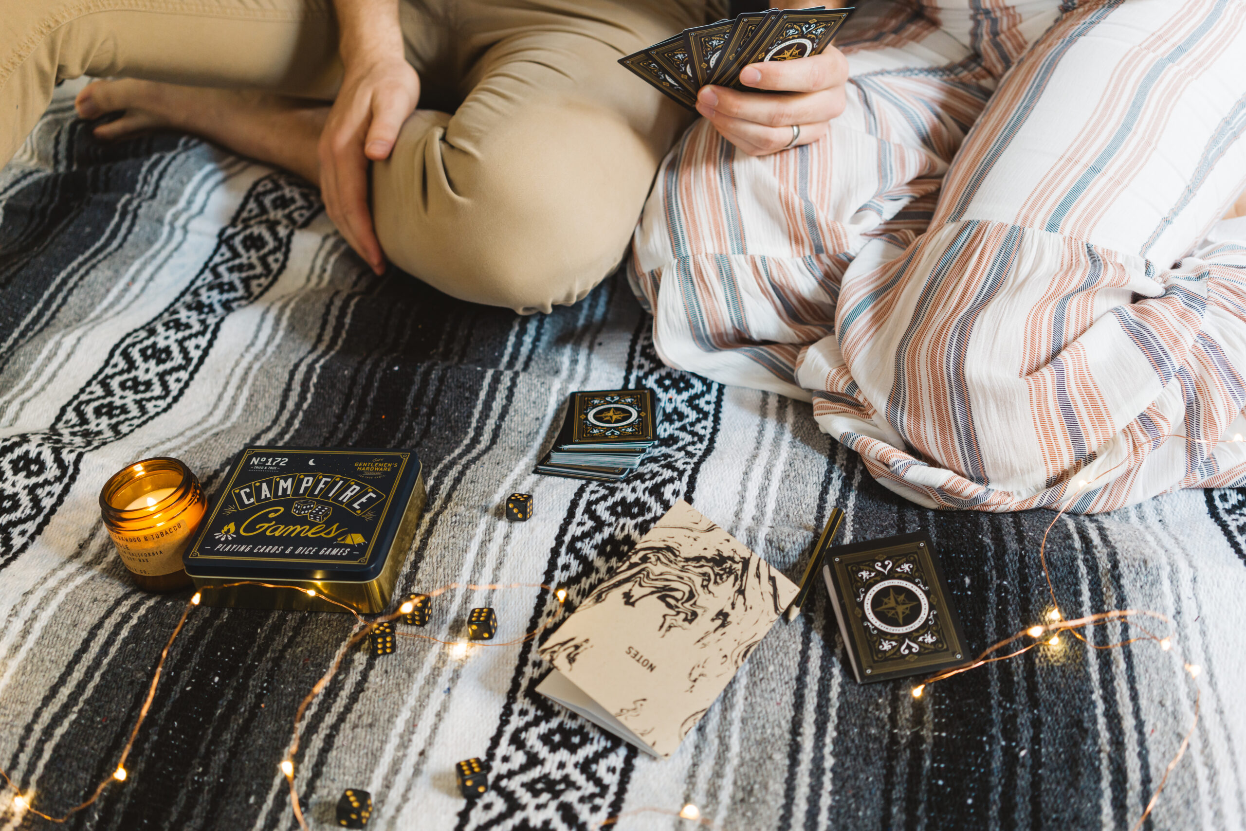 A couple plays a game with cards.