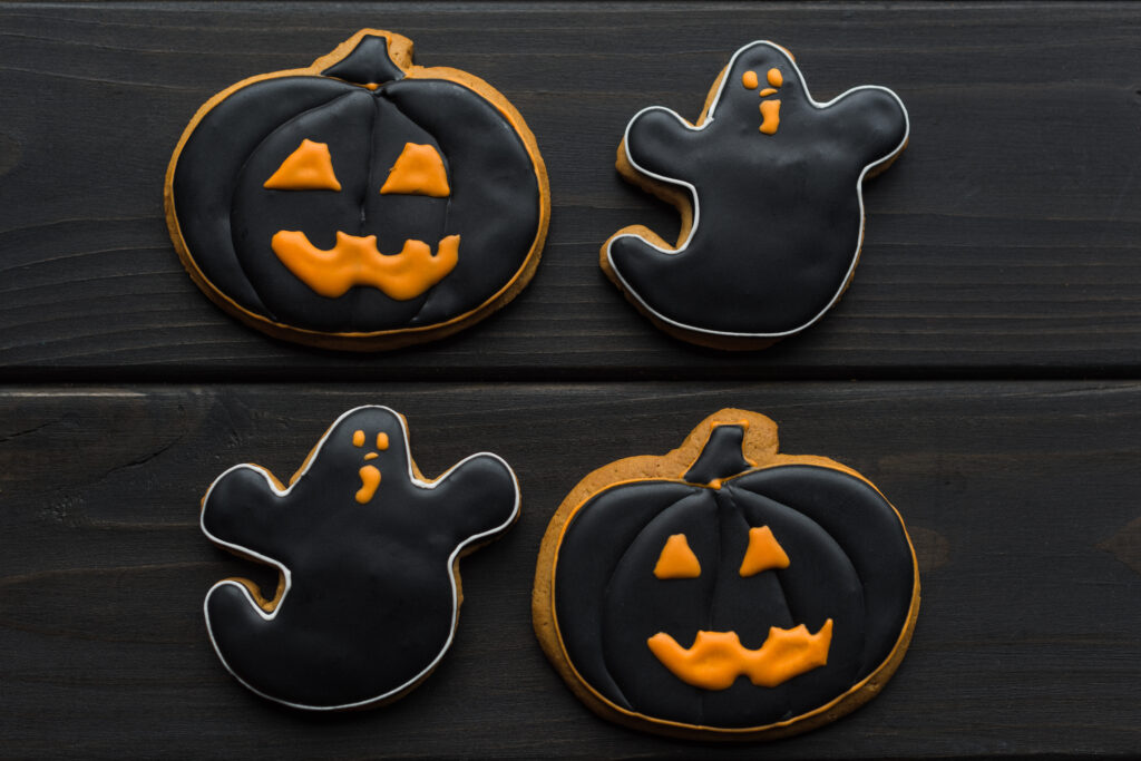 Four Halloween cookies on a table.