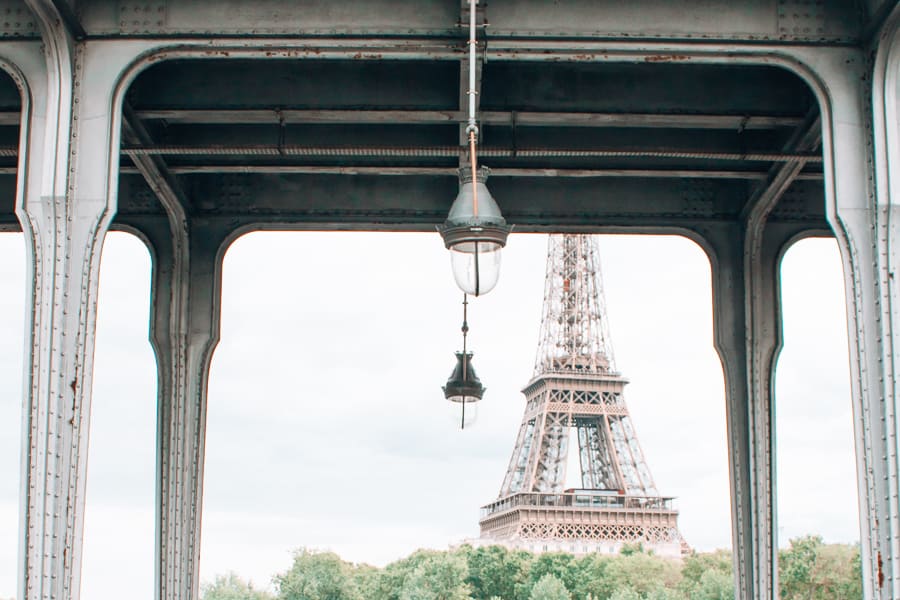 View of the Eiffel Tower through an arch-shaped building.