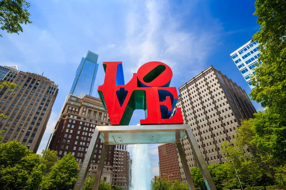 Close up of a sculpture that says LOVE in red.