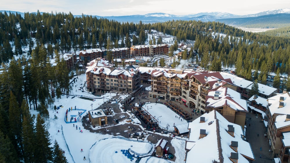 Aerial view of a resort with Alpine-style architecture.