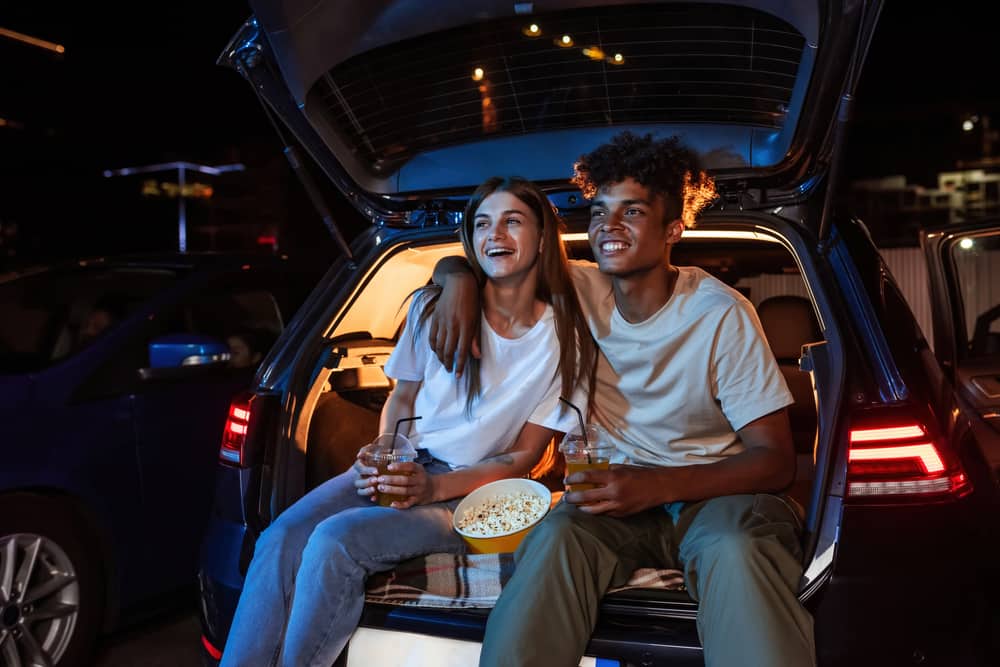 Couple enjoying a drive in movie together