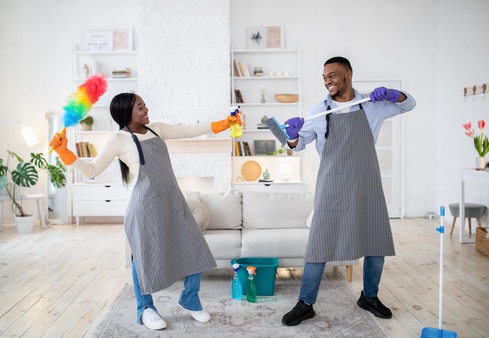 couple being playful while doing chores