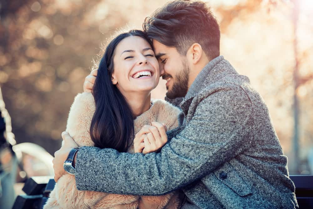 Couple smiling and hugging with cute ways to say I love you